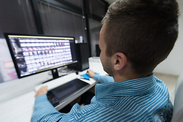 Image showing photo editor at his desk