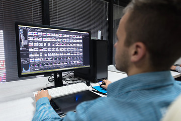 Image showing photo editor at his desk