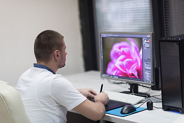 Image showing photo editor at his desk