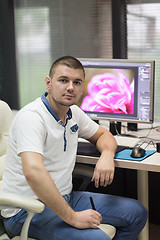 Image showing photo editor at his desk