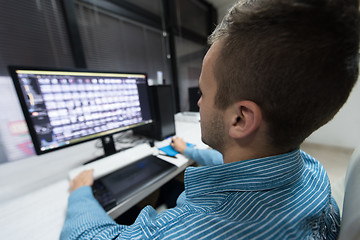 Image showing photo editor at his desk