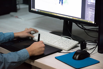 Image showing photo editor at his desk