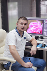 Image showing photo editor at his desk