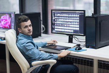 Image showing photo editor at his desk