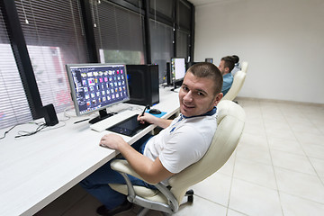 Image showing photo editor at his desk