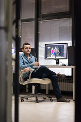 Image showing photo editor at his desk