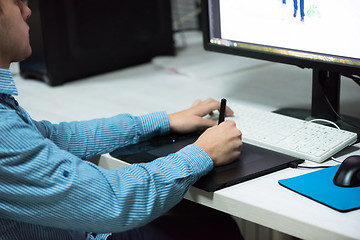 Image showing photo editor at his desk