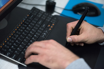 Image showing photo editor at his desk