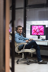 Image showing photo editor at his desk