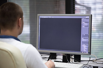 Image showing photo editor at his desk