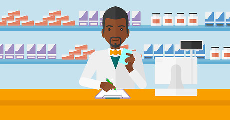 Image showing Pharmacist taking notes.