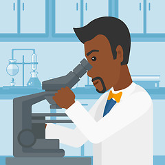 Image showing Laboratory assistant with microscope.