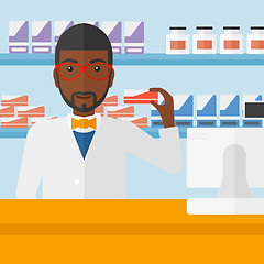 Image showing Pharmacist showing some medicine.