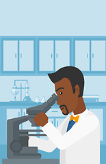 Image showing Laboratory assistant with microscope.