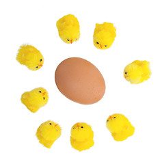Image showing Easter chicks surrounding a large egg