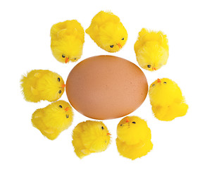 Image showing Easter chicks surrounding a large egg