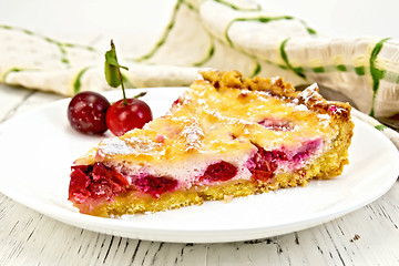 Image showing Pie cherry with sour cream in plate on light board