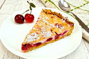 Image showing Pie cherry with sour cream on board