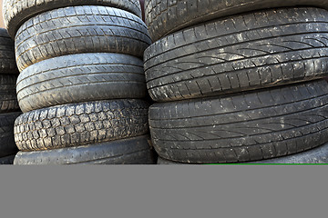 Image showing used car tires. close-up  