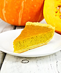 Image showing Pie pumpkin in plate on board