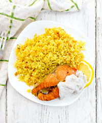 Image showing Salmon with rice on board top