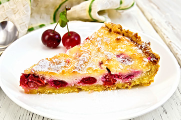 Image showing Pie cherry with sour cream in plate on board