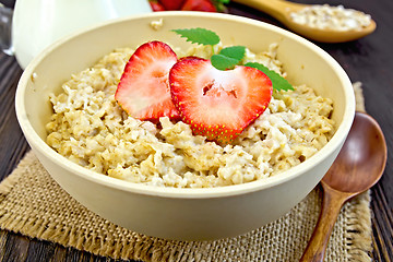 Image showing Oatmeal with strawberries on sacking