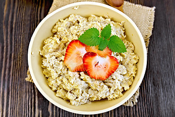 Image showing Oatmeal with strawberries on sacking top