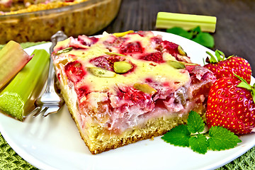 Image showing Pie strawberry-rhubarb with sour cream on table