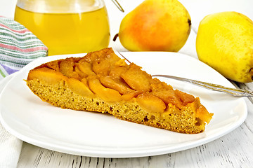 Image showing Pie with pears and honey in plate on board