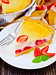 Image showing Pie strawberry with sour cream on dark board