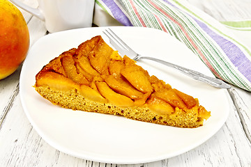 Image showing Pie with pears and honey in plate on light board