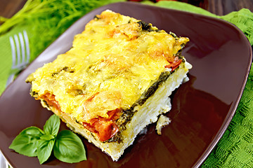 Image showing Pie potato with tomato and spinach on board