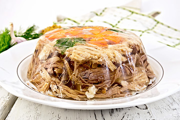 Image showing Jellied in big plate with parsley and carrots on board
