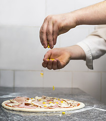 Image showing Making the Pizza - Hands Detail 