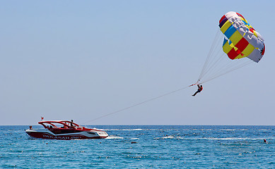 Image showing Parasailing in a blue sky 