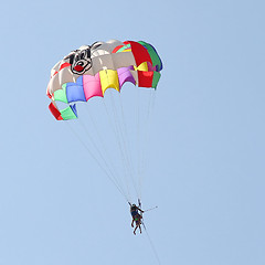 Image showing Parasailing in a blue sky 