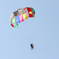 Image showing Parasailing in a blue sky 