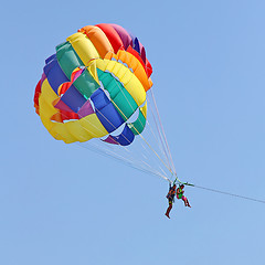 Image showing Parasailing in a blue sky