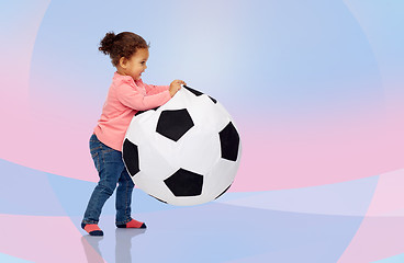 Image showing happy mulatto little baby girl playing with ball