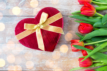 Image showing close up of red tulips and chocolate box