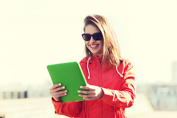 Image showing happy young woman or teenage girl with tablet pc