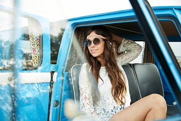 Image showing smiling young hippie woman in minivan car