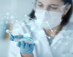 Image showing close up of scientist holding petri dish in lab