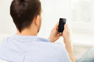 Image showing close up of man with smartphone at home