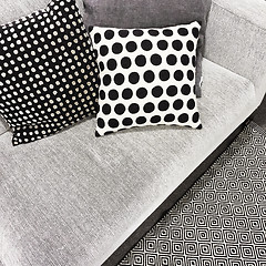 Image showing Black and white polka dot cushions on a sofa