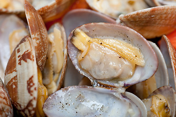 Image showing fresh clams on an iron skillet