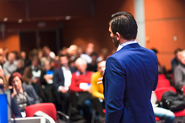 Image showing Public speaker giving talk at Business Event.