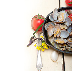 Image showing fresh clams on an iron skillet