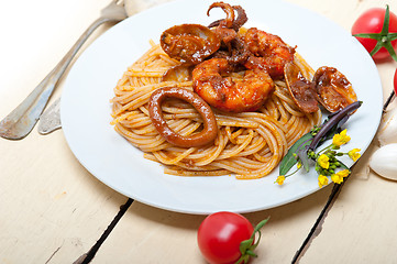 Image showing Italian seafood spaghetti pasta on red tomato sauce 